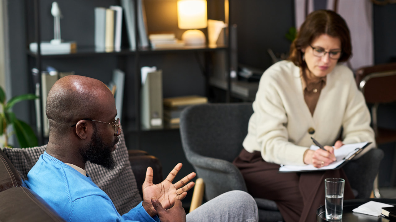 A man in a therapy session.